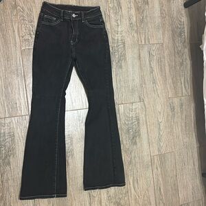 These are boot cut black Jeans with a butter fly design of the pockets